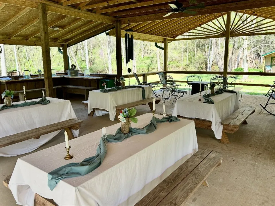 A past reception setup inside the covered pavilion at Rooster Run Venue.